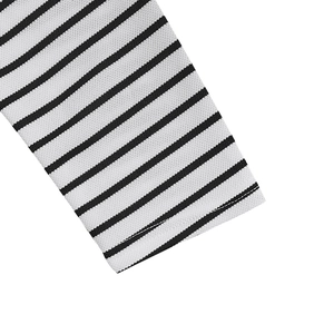 Detailed macro view of black and white striped knit shirt cuff with ribbed texture