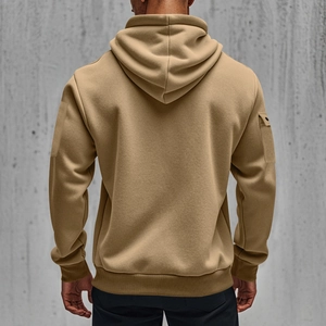 Detail view of khaki pullover hoodie showing ribbed cuffs and utility sleeve pocket detail