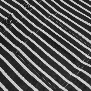 Detail of piqué fabric texture on black and white striped Henley shirt with pocket