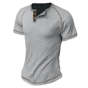 Close-up of grey waffle knit Henley shirt with brown contrast stitching and buttons