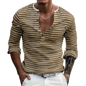 Detail view of mustard brown striped Henley shirt showing buttons and chest pocket texture