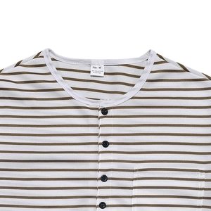 Close-up of men's striped Henley shirt neckline with black buttons and chest pocket