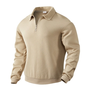 Detailed view of the khaki men's quarter-zip sweatshirt featuring geometric waffle texture