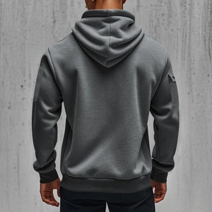 Close-up of dark grey hoodie with utility cargo sleeve pocket and ribbed knit cuff detailing