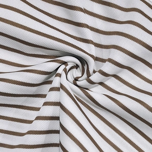 Detailed macro view of brown and white striped pique cotton fabric with breathable texture