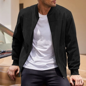 Detail of a black suede bomber jacket with ribbed collar and high-quality zipper texture