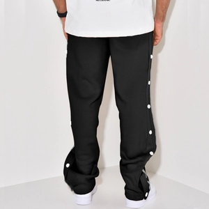 Rear view of men's loose straight casual pants with white side snap buttons in black
