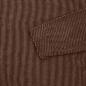 Close-up of ribbed texture and stitching detail on dark brown corduroy long sleeve cuff