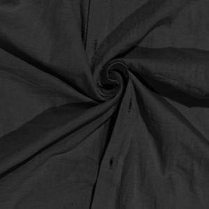Detailed close-up showing the premium fabric texture and buttonhole on a black cotton linen shirt