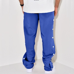 Detail view of Klein blue straight trousers with white side snap button design for men