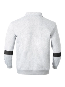 Rear view of vintage polo shirt with grey texture, collar, and black sleeve panel details