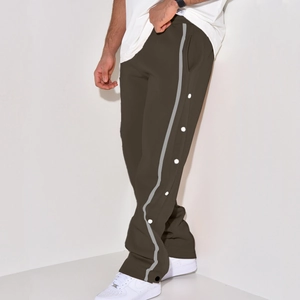 Detail view of olive green retro trousers with side snap buttons and grey side stripes