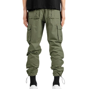 Détails du pantalon cargo vert armée avec grandes poches à rabat et chevilles ajustables