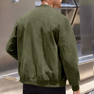 Outdoor back view of an olive green faux suede bomber jacket with ribbed cuffs and hem