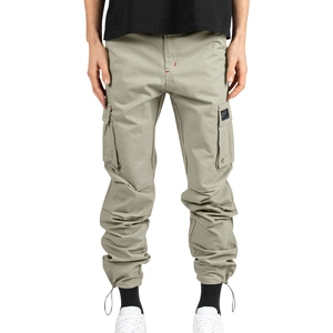 Détail du pantalon cargo kaki avec poches latérales et ourlets à cordon stylés