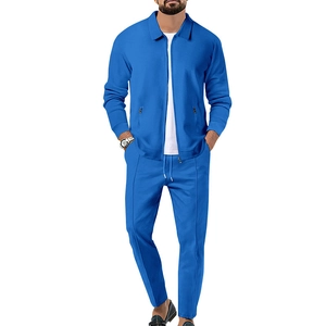 Macro detail of royal blue waffle texture fabric on men's zip-up jacket and pants