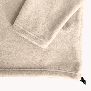 Detail of beige fleece hoodie with drawstring hem and reinforced double stitching