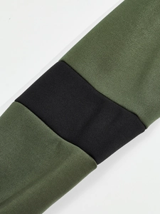 Close-up of color-block long sleeve cuff showing army green and black knit fabric texture