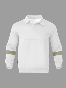 Detail of white long sleeve polo shirt featuring green sleeve stripes and brand tag