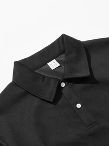 Detail of Polo shirt collar with 95% polyester 5% elastane fabric label and white buttons