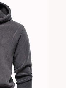 Detailed close-up showing the soft fleece texture and seams of a grey hooded sweatshirt