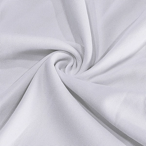 Close-up of white breathable mesh fabric with fine honeycomb texture for polo shirts