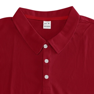 Macro detail of men's polo shirt neckline with three white buttons and size M tag