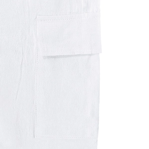 Detail shot of the white linen cargo pocket with neat stitching on casual shorts