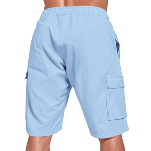 Detail view of sky blue cargo shorts with elastic waist and large flap pockets