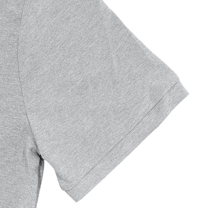 Close-up detail of grey short sleeve cuff with textured pique cotton fabric and stitching