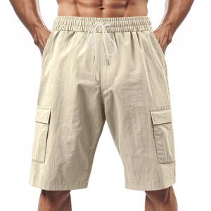 Detail view of men's linen cargo shorts showing drawstring waist and side flap pockets