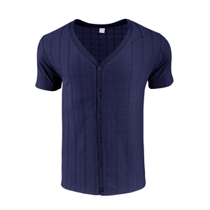 Detail of navy blue V-neck knit shirt showing textured fabric and button closure