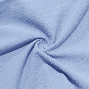 Macro shot of light blue breathable linen fabric texture with natural weave details