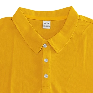 Detail view of yellow Polo shirt neckline featuring three white buttons and ribbed collar