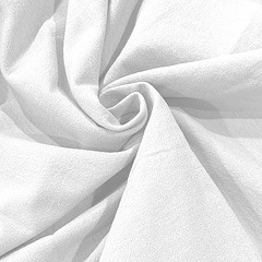 Detailed macro view of white cotton linen fabric showing tight weave texture and soft folds