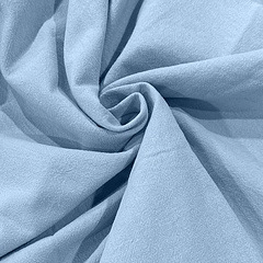 Macro view of light blue cotton linen fabric showing smooth texture and fine plain weave