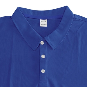 Detailed macro view of the polo shirt collar, buttons, and size M label on blue fabric