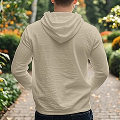 Back view of men's beige cotton linen hooded shirt in a natural garden setting
