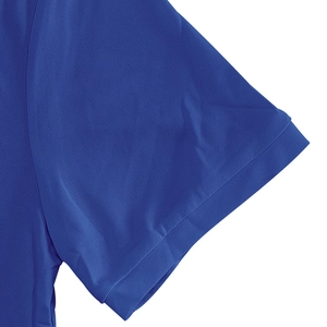 Close-up of royal blue breathable mesh pique fabric and neat stitching on polo shirt sleeve
