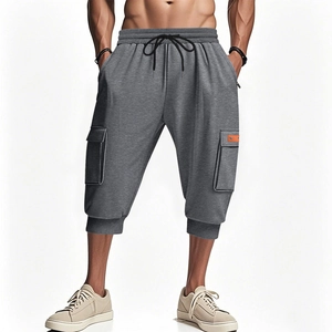 Men's dark grey heavy cargo shorts with drawstring waist and multi-pocket utility design