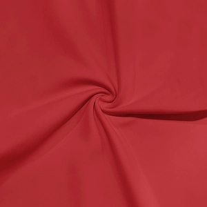 Detail of red sleeveless hoodie fabric showing soft texture and smooth drape quality