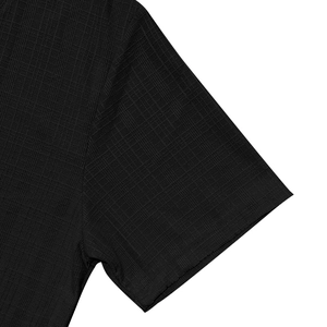 Detail of black V-neck T-shirt showing breathable waffle texture and neat stitching