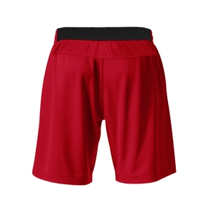 Detail view of red men's sports shorts with black elastic waistband and breathable fabric