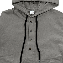 Detail view of cotton linen hoodie with dark wooden buttons and black drawstrings