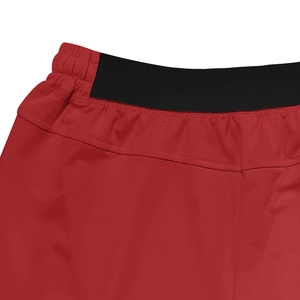 Detailed macro view of the elastic waistband on red and black quick-dry sport shorts