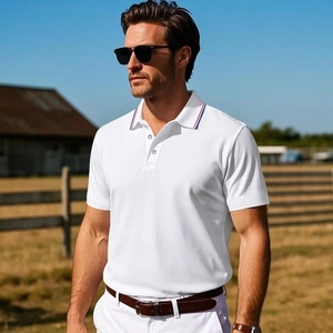 Detail of white men's polo shirt with striped collar in a rustic outdoor setting