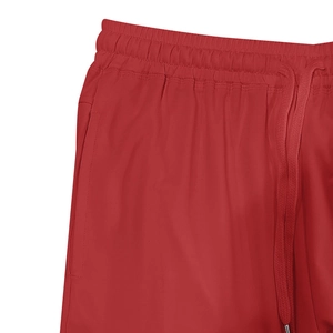 Detail of red elastic waistband with flat drawstring and silver metal tips on shorts