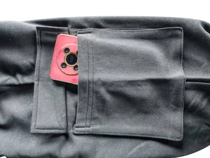 Detail shot of multi-pocket cargo shorts showing the heavy knit fabric and phone storage