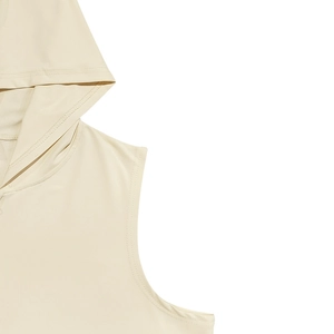 Detailed close-up showing reinforced cuff stitching on a beige hooded sleeveless top