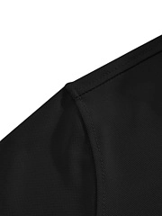 Detail of double-needle shoulder stitching on a black moisture-wicking polo shirt